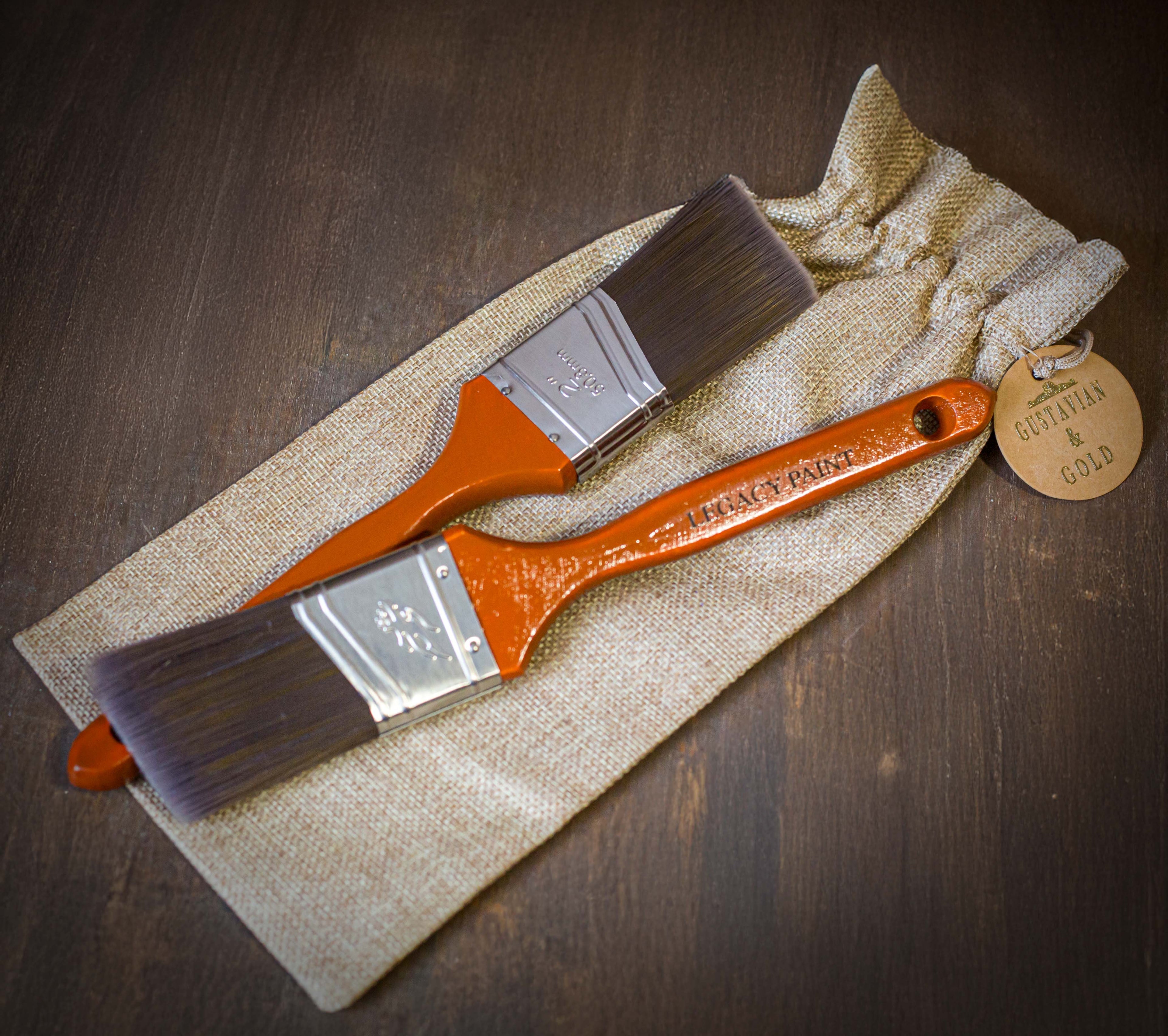 Legacy Paint professional brushes engraved on burlap - Premium artisan tools for bespoke furniture restoration and fine finishes