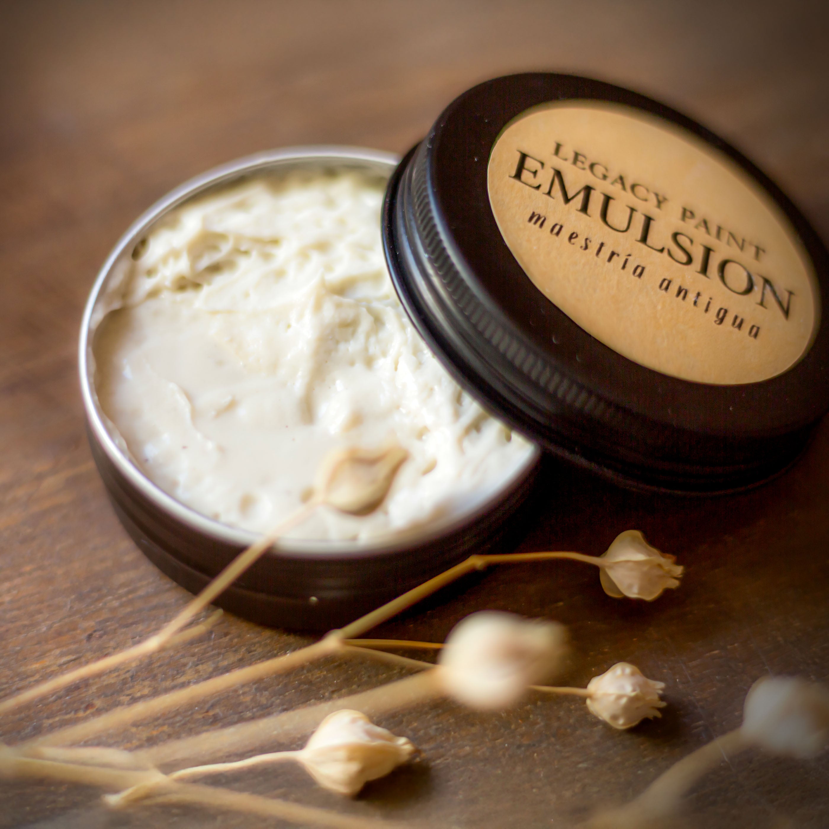 Legacy Paint Raw Emulsion Texture: Open jar revealing the unadulterated density of our encaustic-based medium. Hand-crafted in Spain with olive oil and mineral resins for surface architects and master workshops. A traceable artisan tool for historical reinterpretation and slow-craft furniture finishes